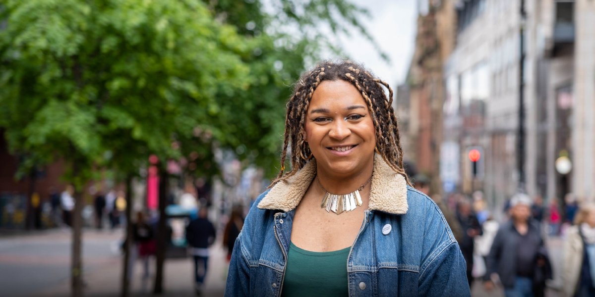 Picture of Iris Duane smiling, wearing a denim jacket