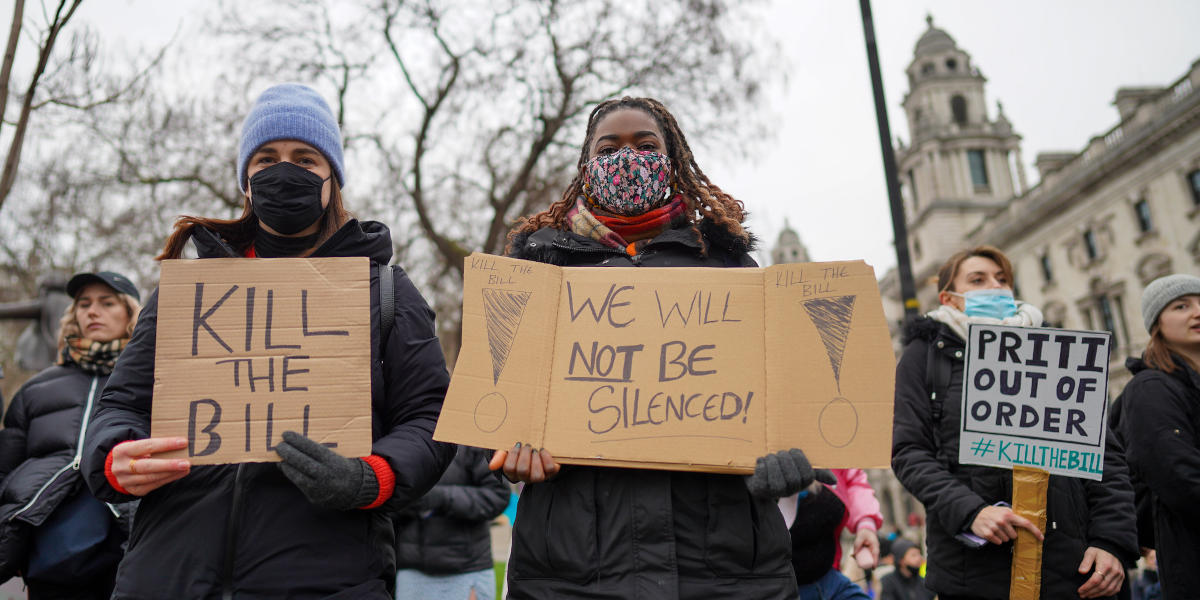 Several women holding placards at a protest, reading from left to right 'Kill the bill', 'We will not be silenced' and 'Priti out of order #Killthebill'