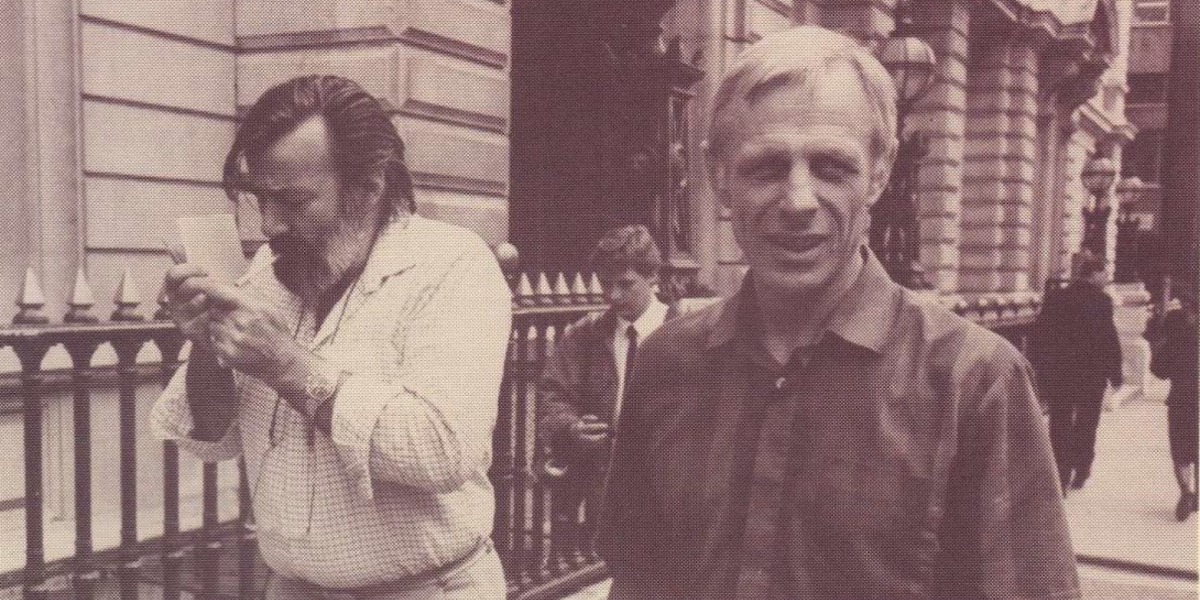 An archive photo of two men – Pat Pottle (who is lighting a cigarette) and Michael Randle – outside the Old Bailey