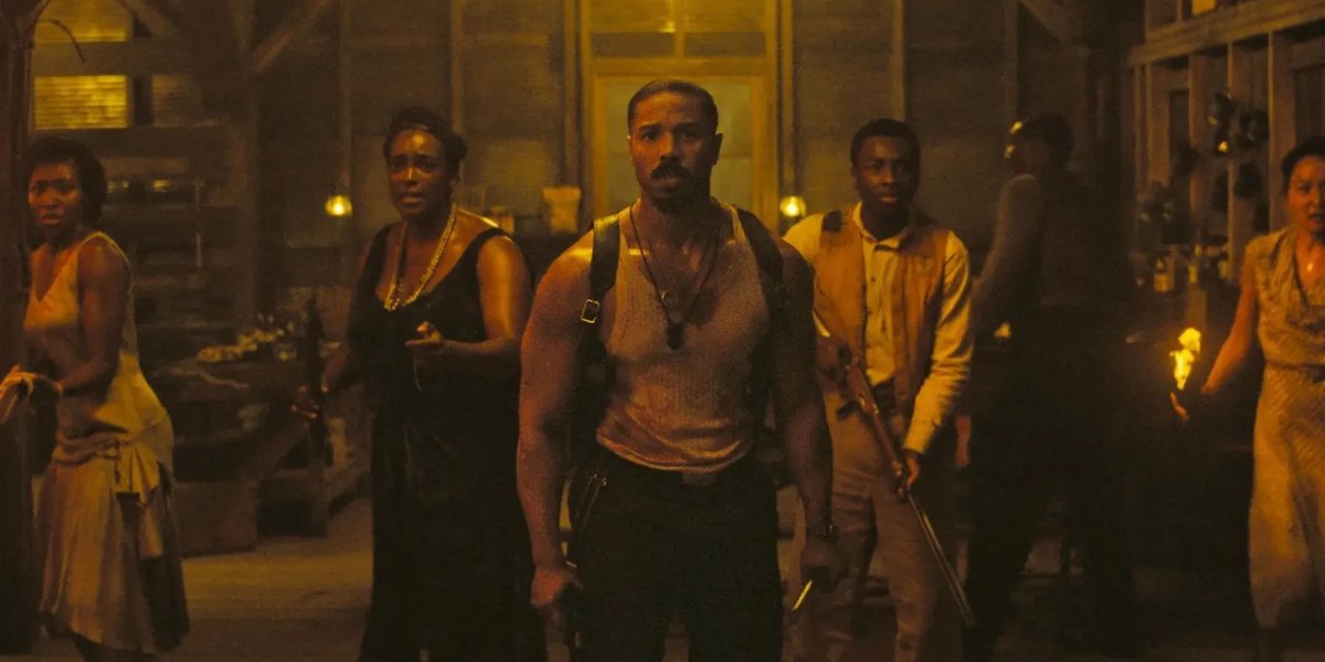 Three blood-covered actors in a scene from the movie Sinners