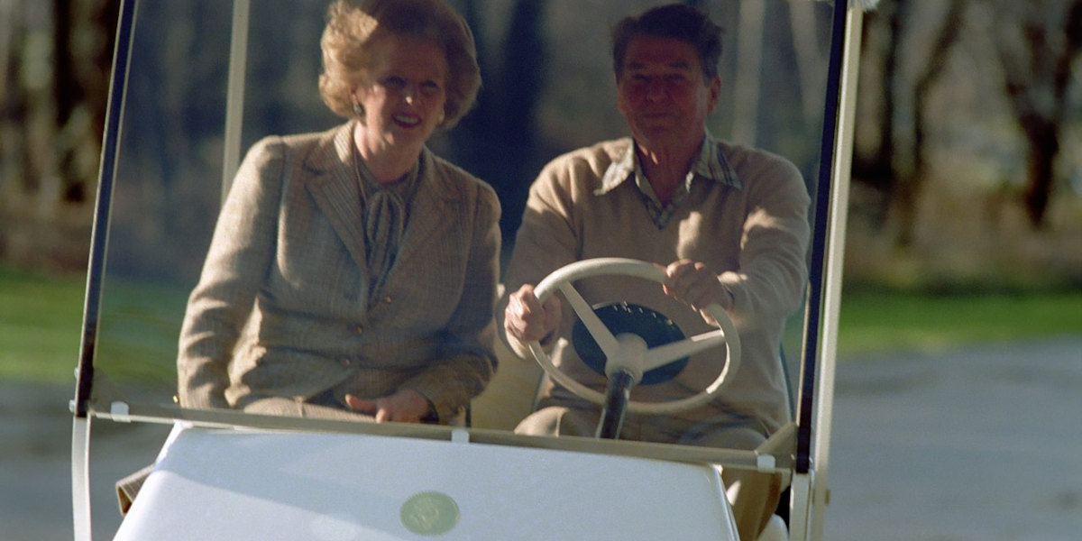Former UK Prime Minister Margaret Thatcher (left) and former US President Ronald Reagan (right) sat together in a golf cart
