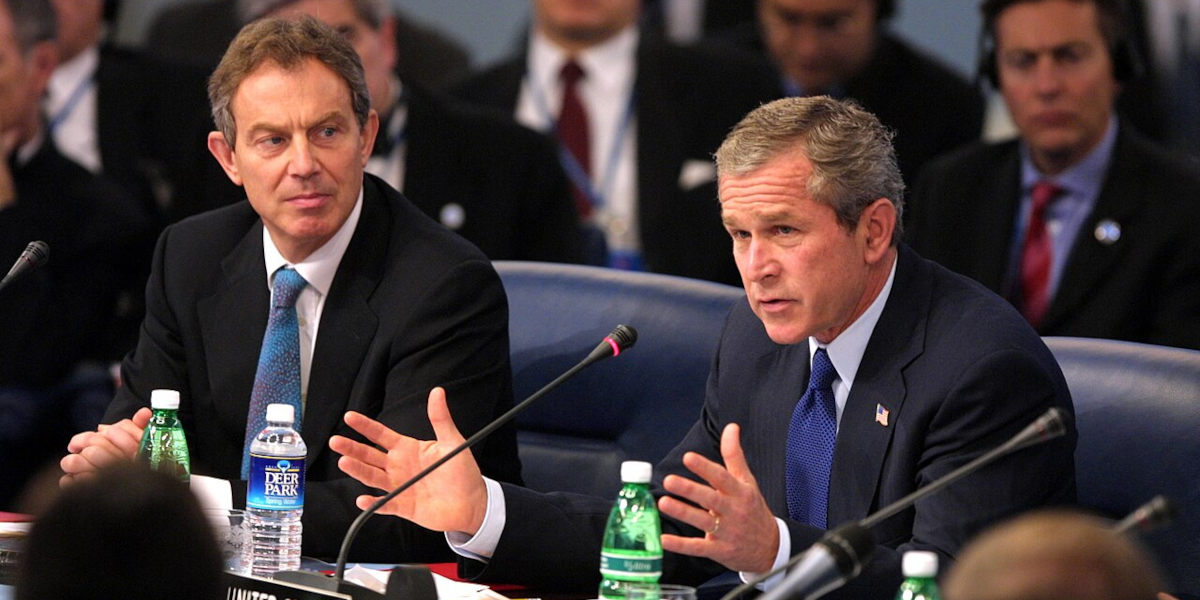 Former UK Prime Minister Tony Blair (left) sat next to former US President George Bush (right) at a meeting of the NATO-Russia Council in Italy